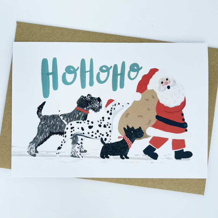 Dogs following Santa - Ho Ho Ho Christmas Card