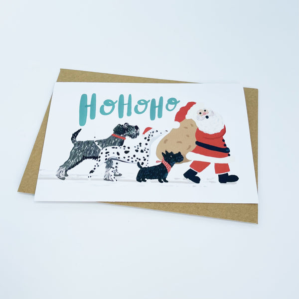 Dogs following Santa - Ho Ho Ho Christmas Card