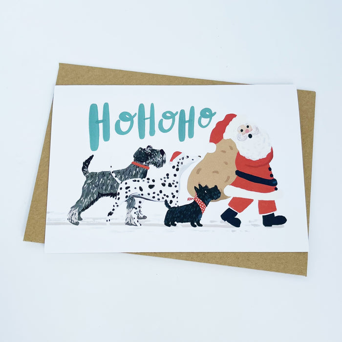 Dogs following Santa - Ho Ho Ho Christmas Card