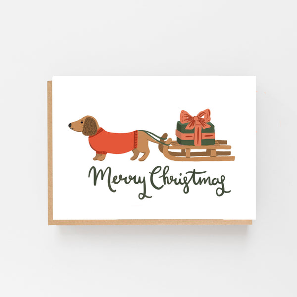 Dachshund pulling a sledge Merry Christmas card