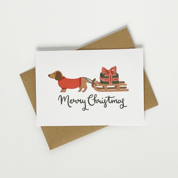 Dachshund pulling a sledge Merry Christmas card