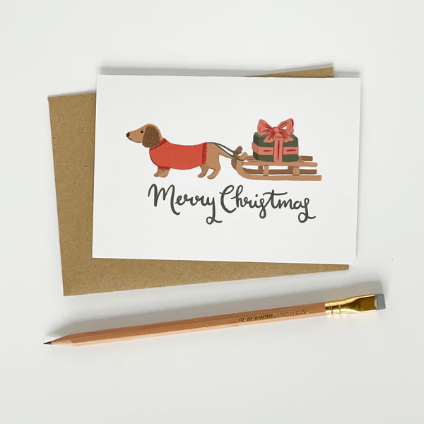 Dachshund pulling a sledge Merry Christmas card