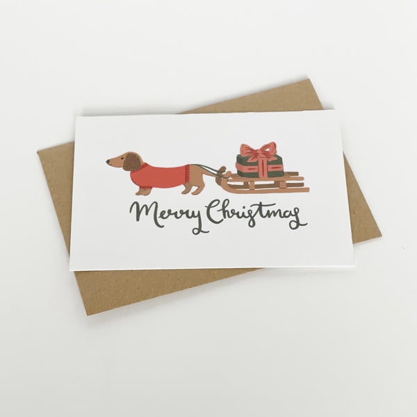 Dachshund pulling a sledge Merry Christmas card