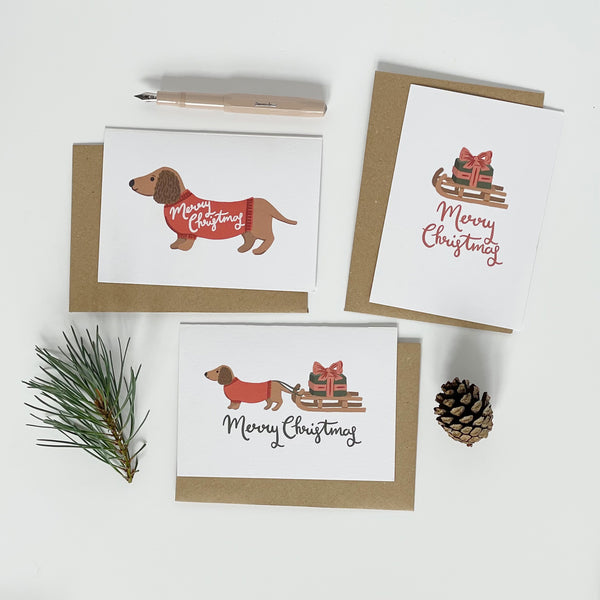 Dachshund pulling a Sledge Merry Christmas Card Pack