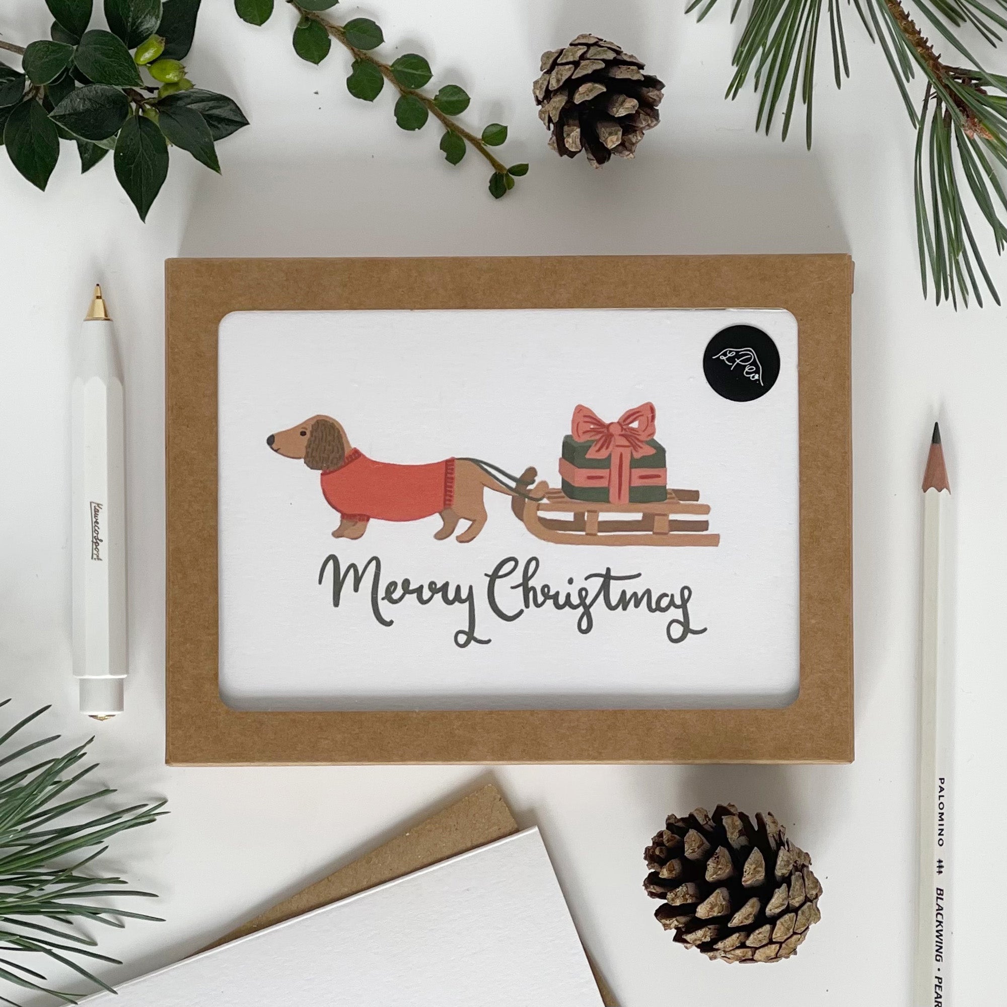 Dachshund pulling a Sledge Merry Christmas Card Pack